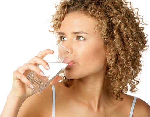 Woman drinking distilled water